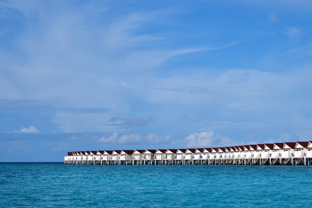 Overwater bungalows on a calm turquoise ocean